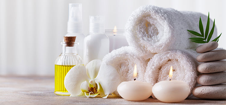 spa tools including towels candles and oils